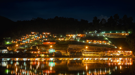 Illuminated Boats Moored Harbor Against Sky Night