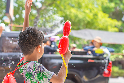 Rear View Boy Holding Squirt Gun